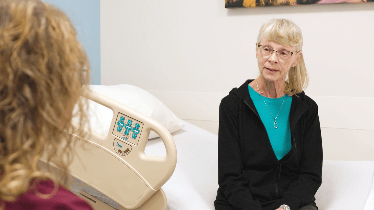 A patient at Astera Health speaking with their provider about cancer screening.